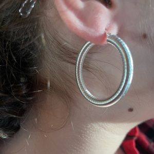 Silver hoops, hollow tube with coiled effect made in stainless steel.